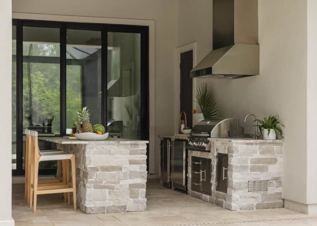 Custom outdoor kitchen designed and built by Donna Mancini Interiors & Flooring and Design Construction Group